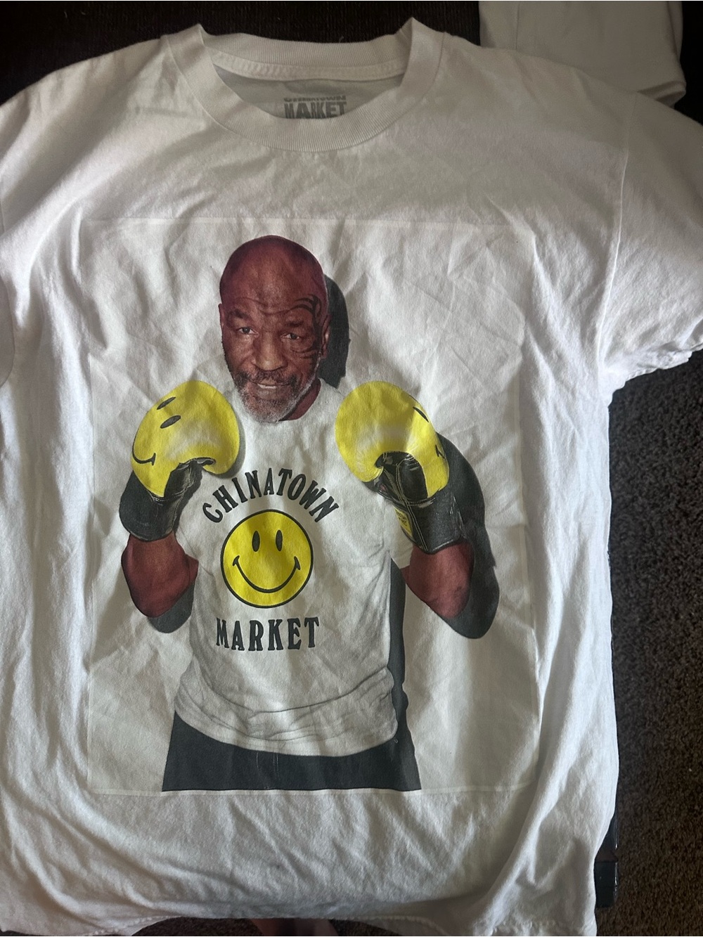 Chinatown Market White Short Sleeve Tee with Yellow Smiley Gloves Graphic